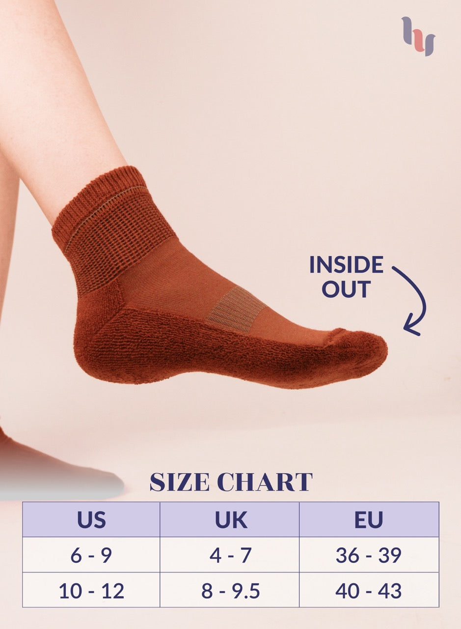 Bombay Brown sock on a leg with size chart below on a beige background