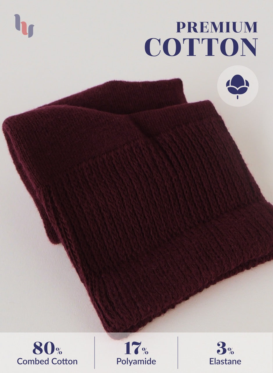 Burgundy knitted scarf on a light gray background with 'Premium Cotton' text and fabric composition details.