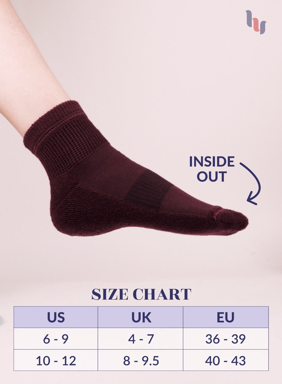 Burgundy sock with size chart on a light background