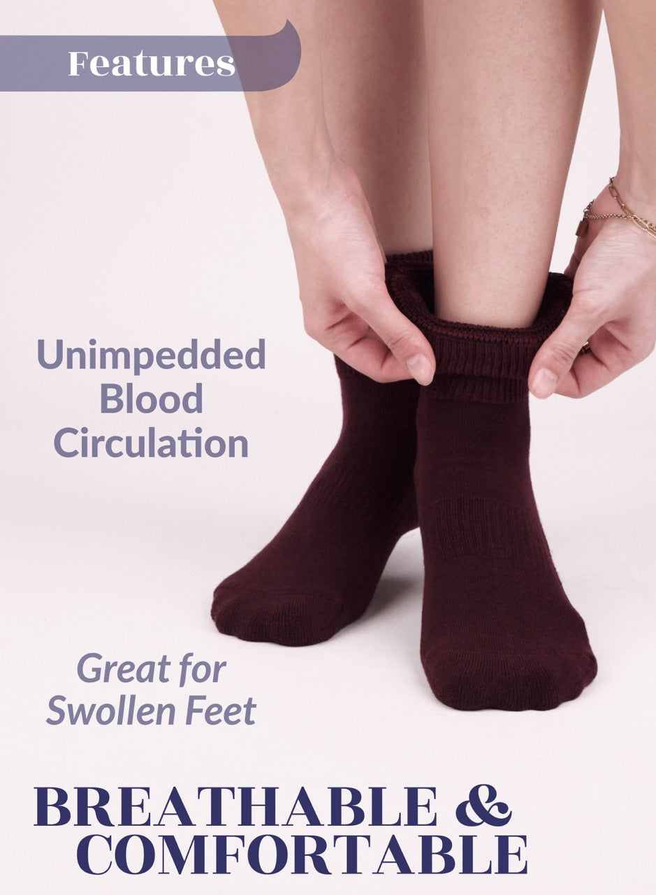 Person wearing Burgundy socks with text about blood circulation and swollen feet on a light background