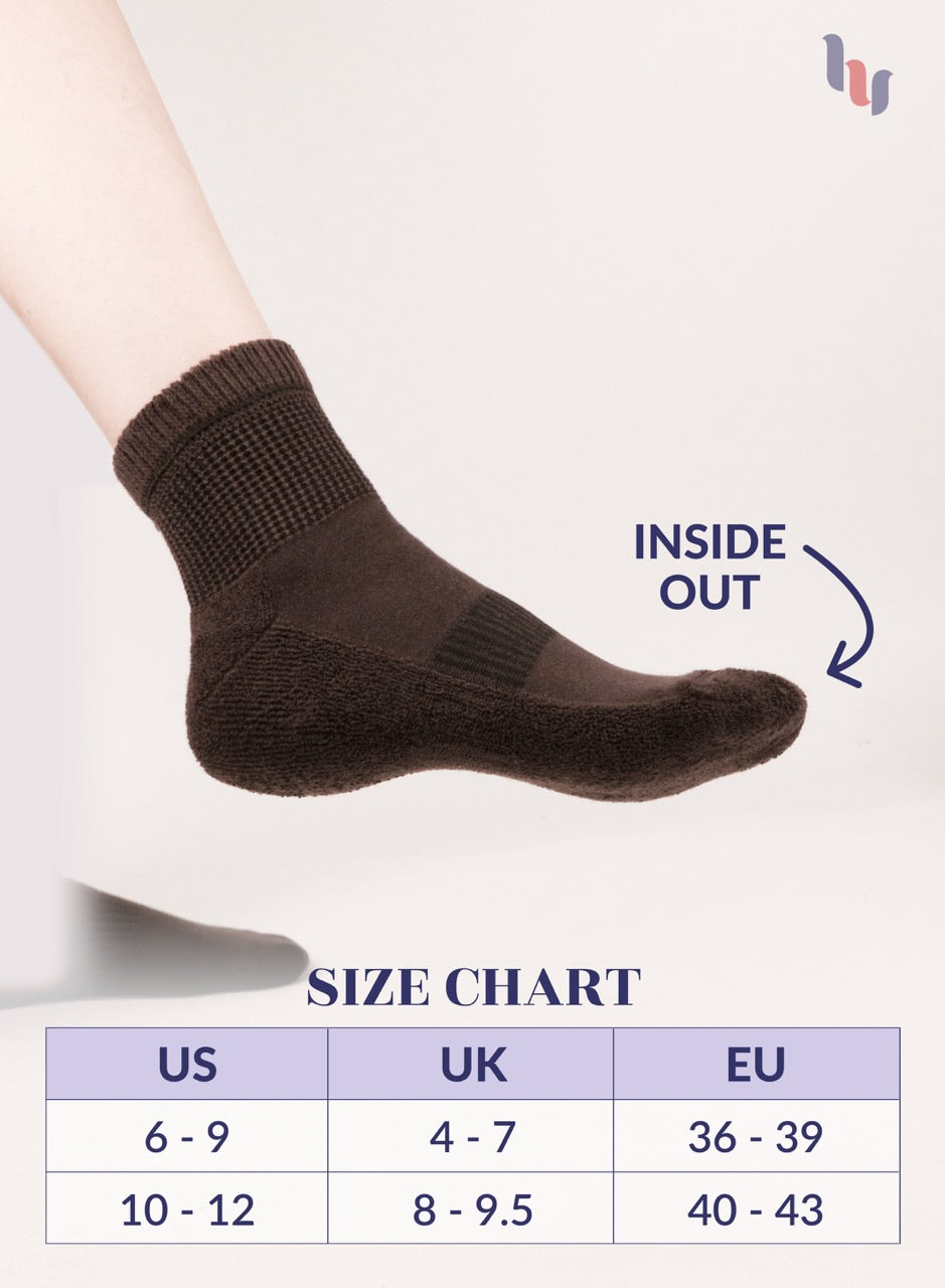 Dark Brown sock on a foot with size chart below