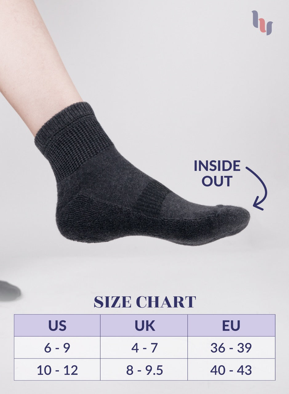 Dark grey sock on a foot with 'Inside Out' text and size chart below on a light gray background