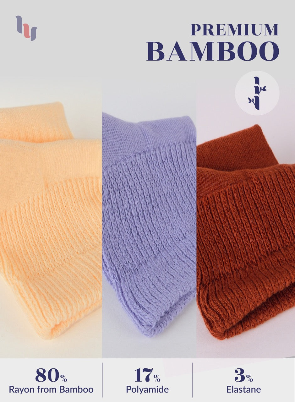 Three folded fabrics in peach, Aster purple, and bombay brown with 'Premium Bamboo' text and fabric composition details on a light gray background.