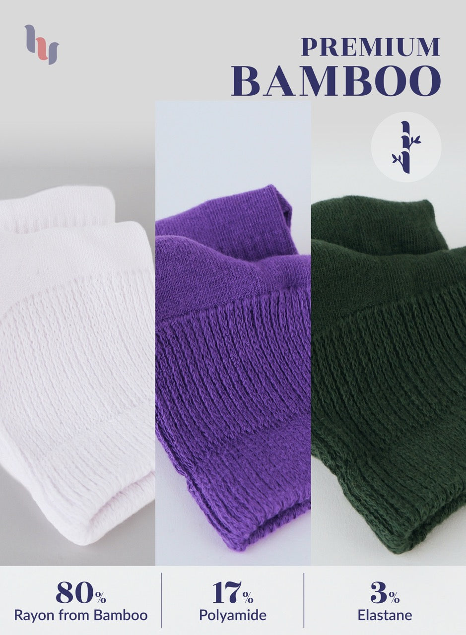 Three folded garments in white, purple, and army green with bamboo text and fabric composition details on a light gray background.