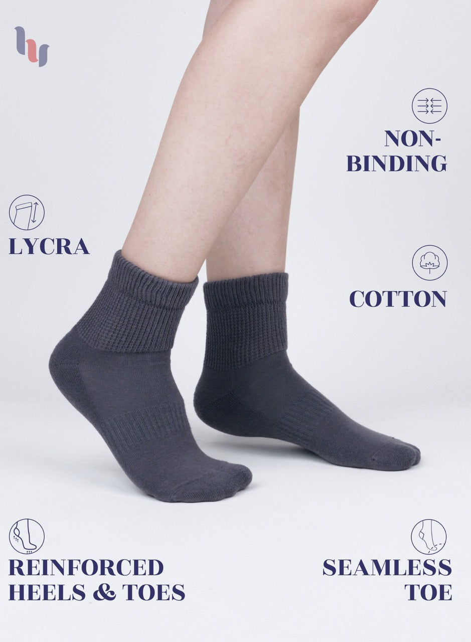 Gray socks with text highlighting features on a light gray background