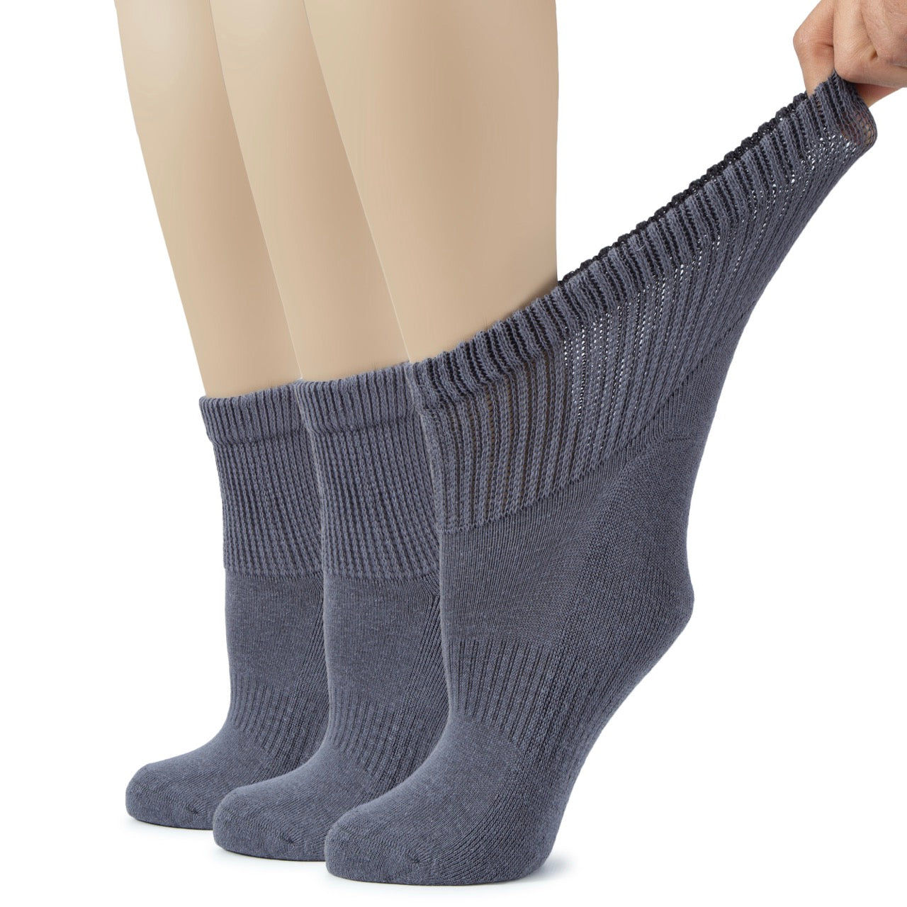Gray socks being worn with a plain background