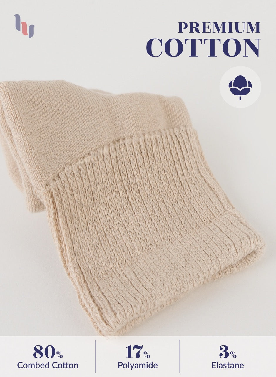 Light Beige knitted blanket with 'Premium Cotton' label and fabric composition details on a white background