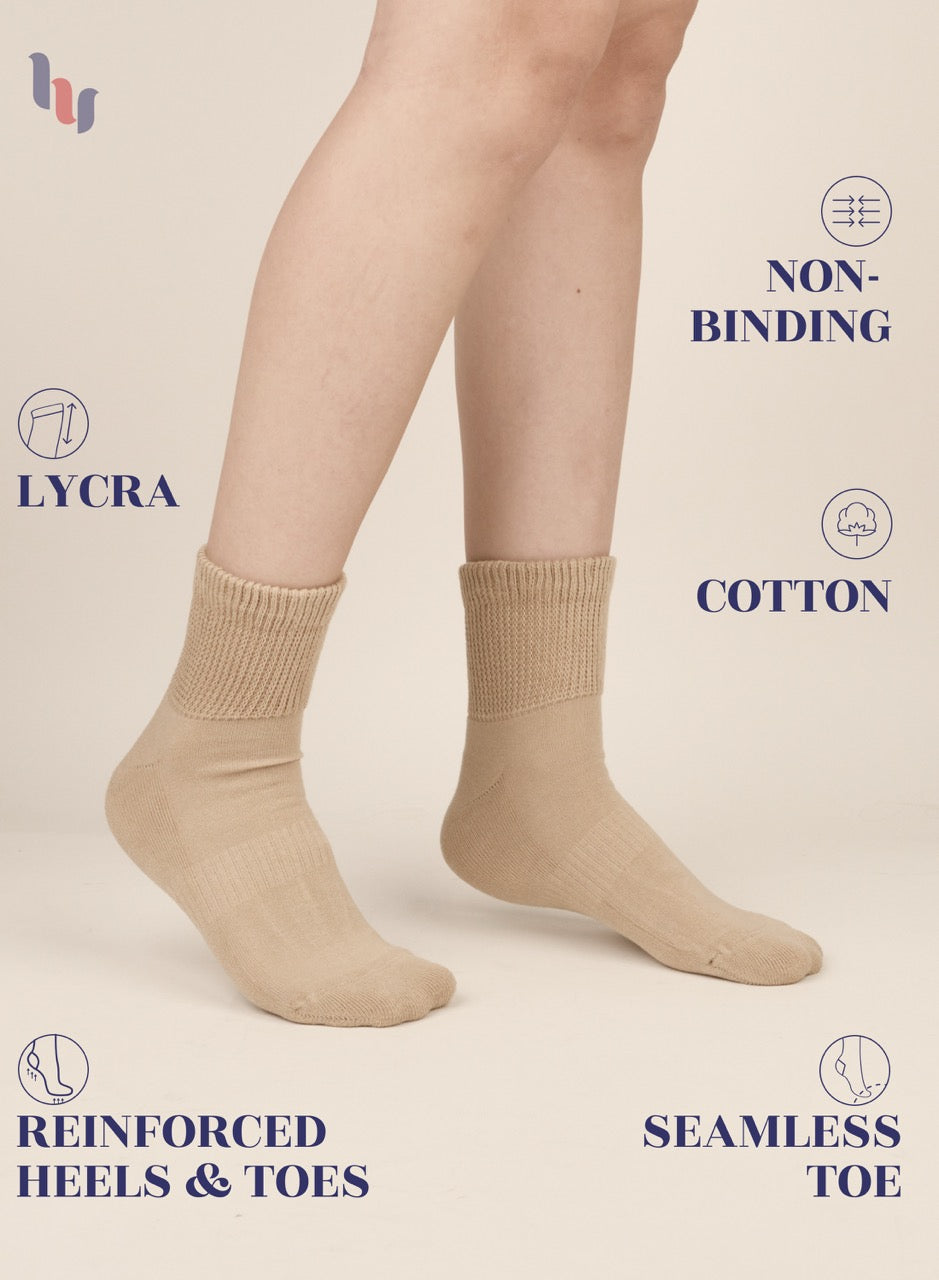 Medium Beige socks worn by a person on a beige background with text highlighting features like 'lycra', 'non-binding', 'cotton', 'reinforced heels & toes', and 'seamless toe'.