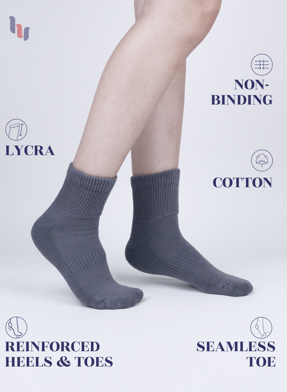 Medium Gray socks worn by a person on a light gray background with text highlighting features.