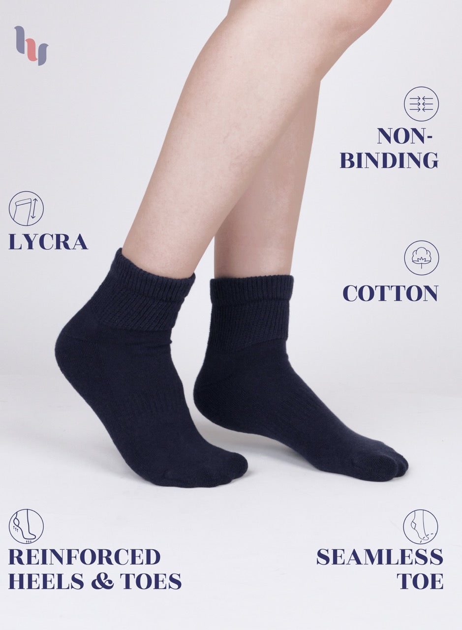 Navy socks worn by a person on a light gray background with text highlighting features.