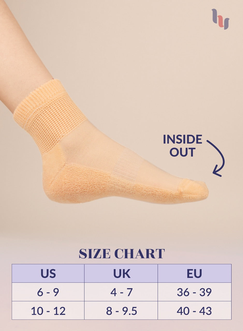Pastel peach sock on a foot with 'Inside Out' text and size chart below on a beige background