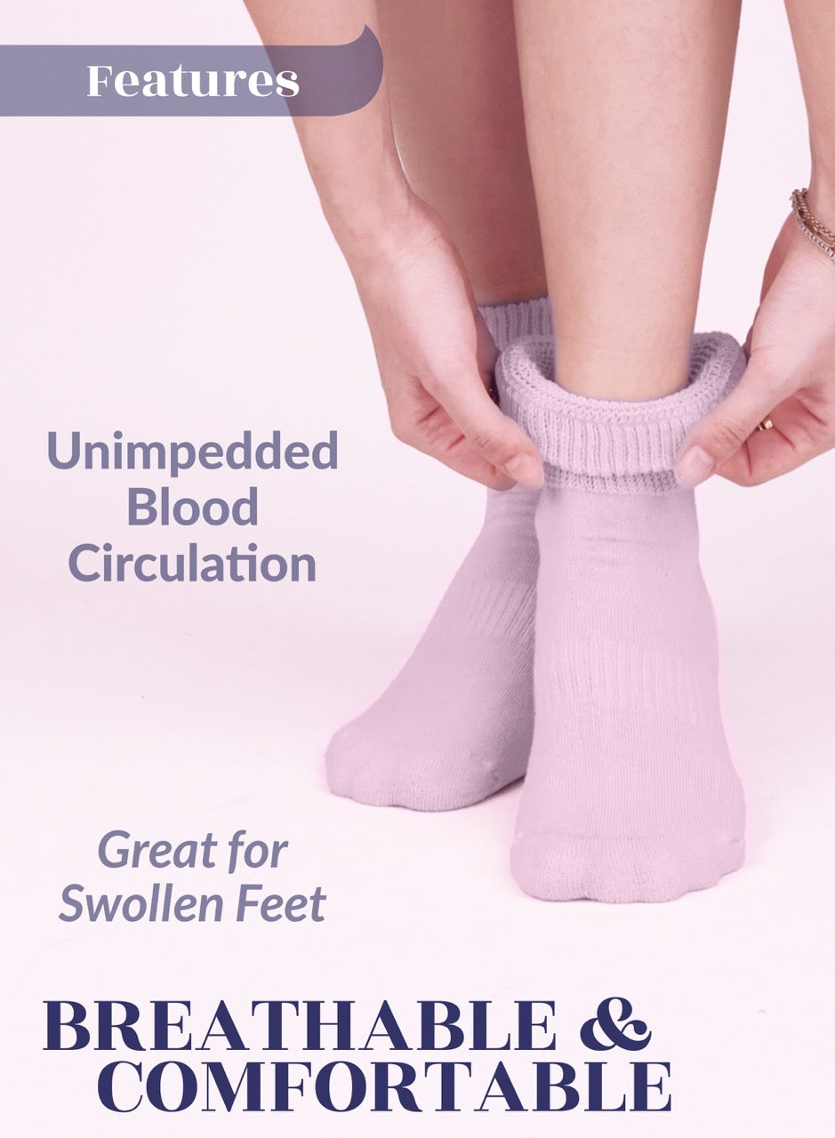 Person wearing Pastel pink socks with text about blood circulation and comfort.