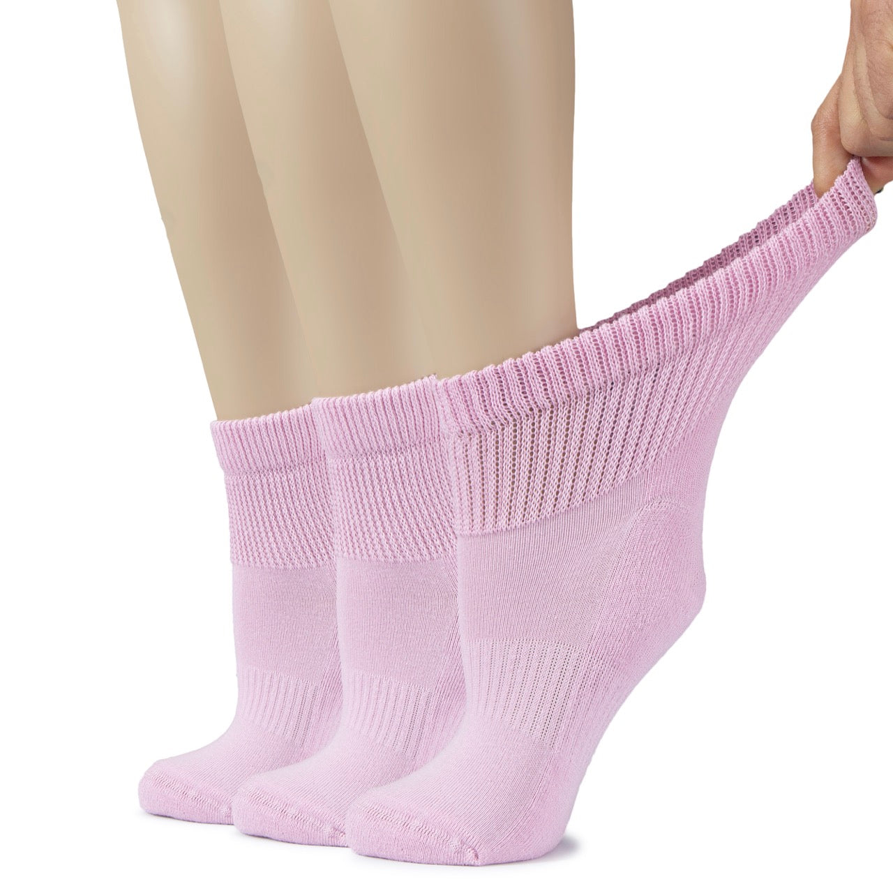 Person wearing pastel pink socks on a white background