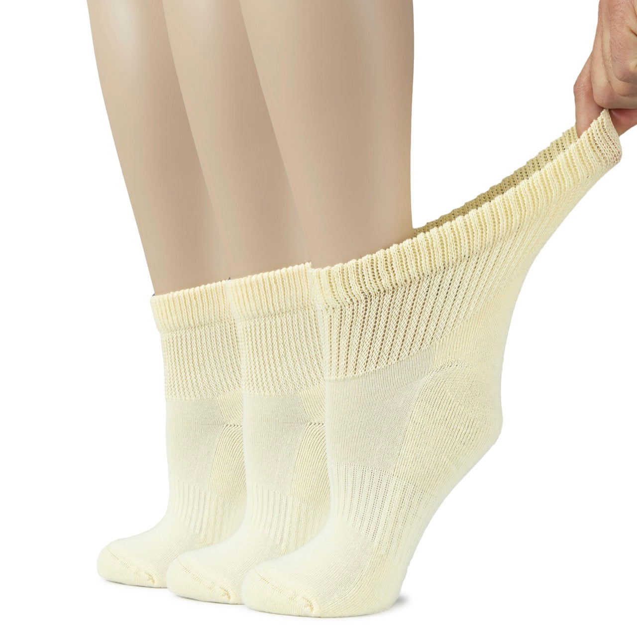 Person wearing pastel yellow socks on a white background