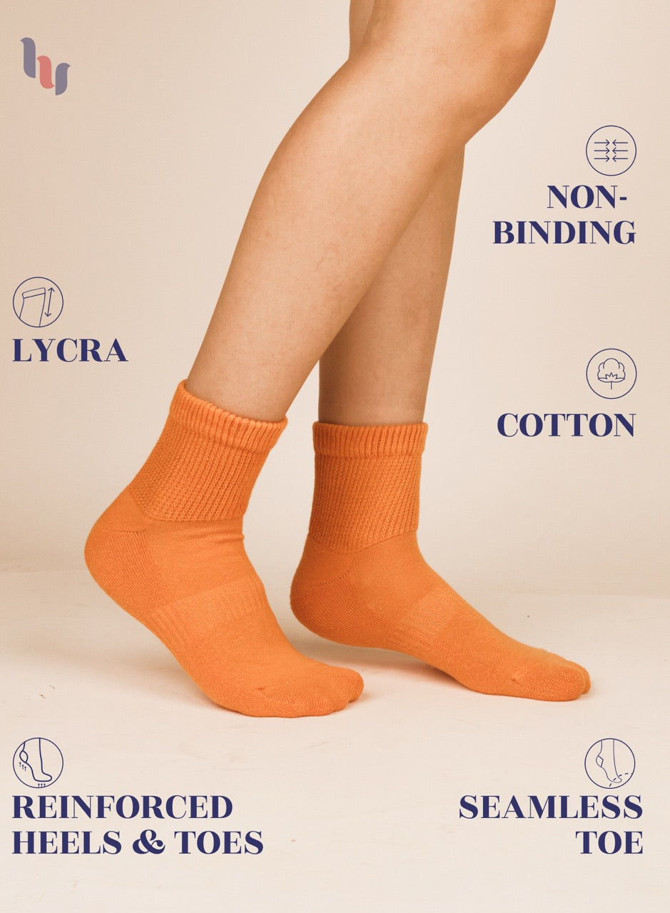 Pumpkin Orange socks worn by a person with text highlighting features on a beige background