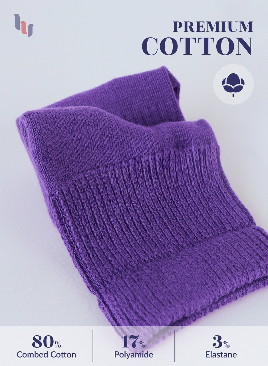 Purple folded towel with text indicating material composition on a light gray background