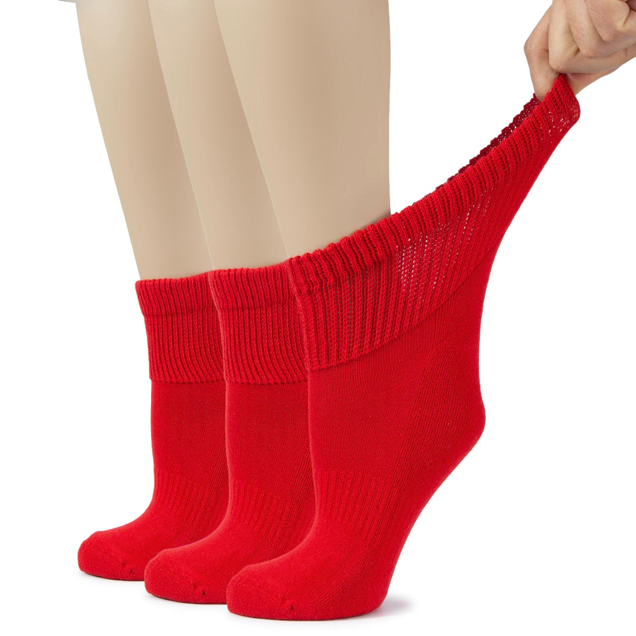 Red socks being pulled up on a white background
