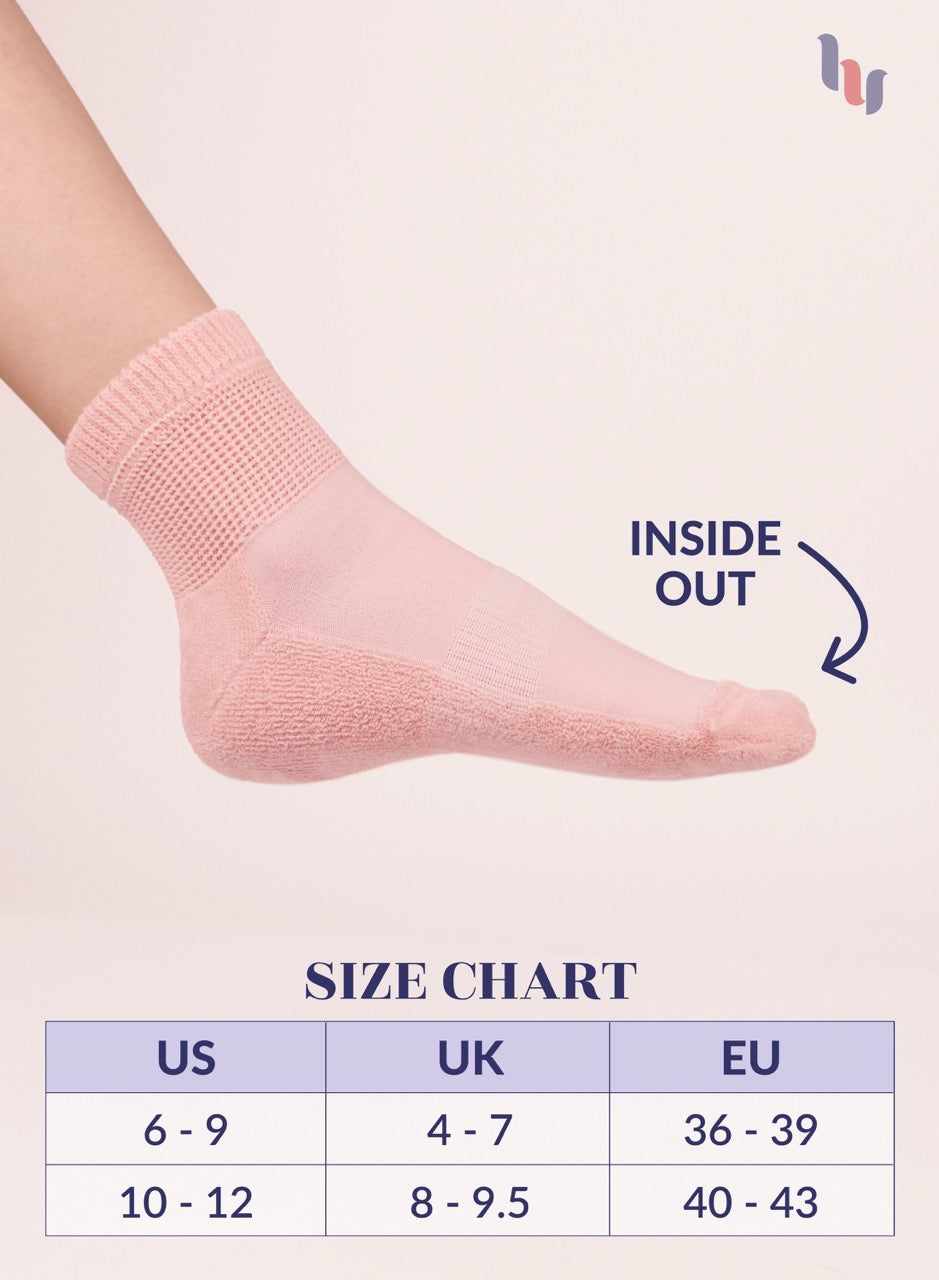 Rose cloud sock on a foot with size chart below on a beige background