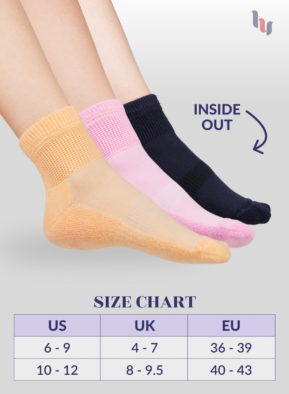 Three pairs of socks in beige, pink, and navy blue on a light gray background with a size chart below.