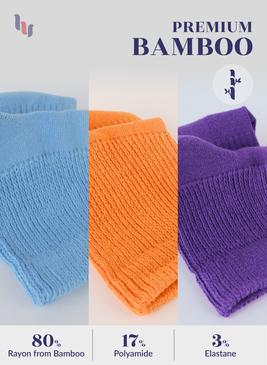 Three pairs of socks in blue, pumpkin orange, and purple with bamboo content information on a light gray background.