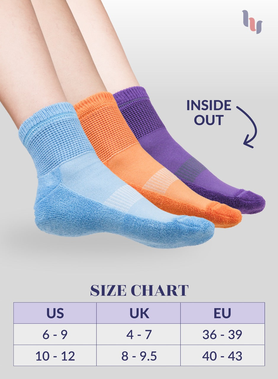 Three pairs of colorful socks with a size chart on a light gray background
