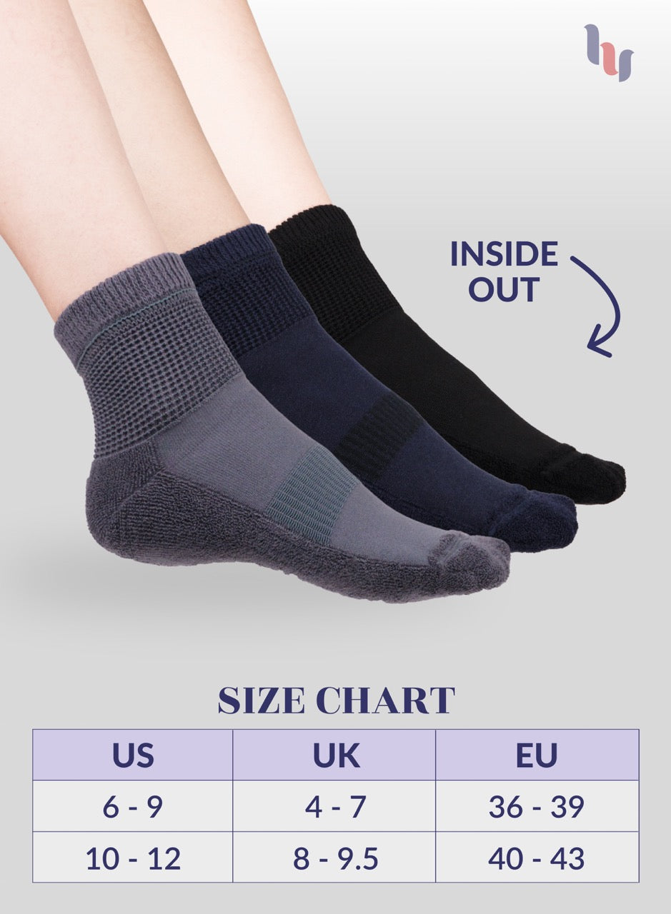 Three pairs of socks with a size chart on a light gray background
