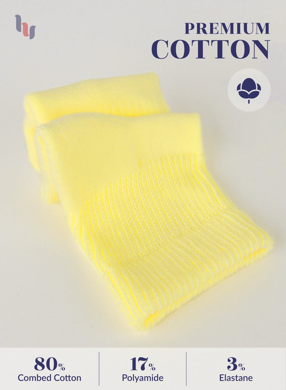 Yellow fabric roll with 'Premium Cotton' label and material composition details on a light gray background