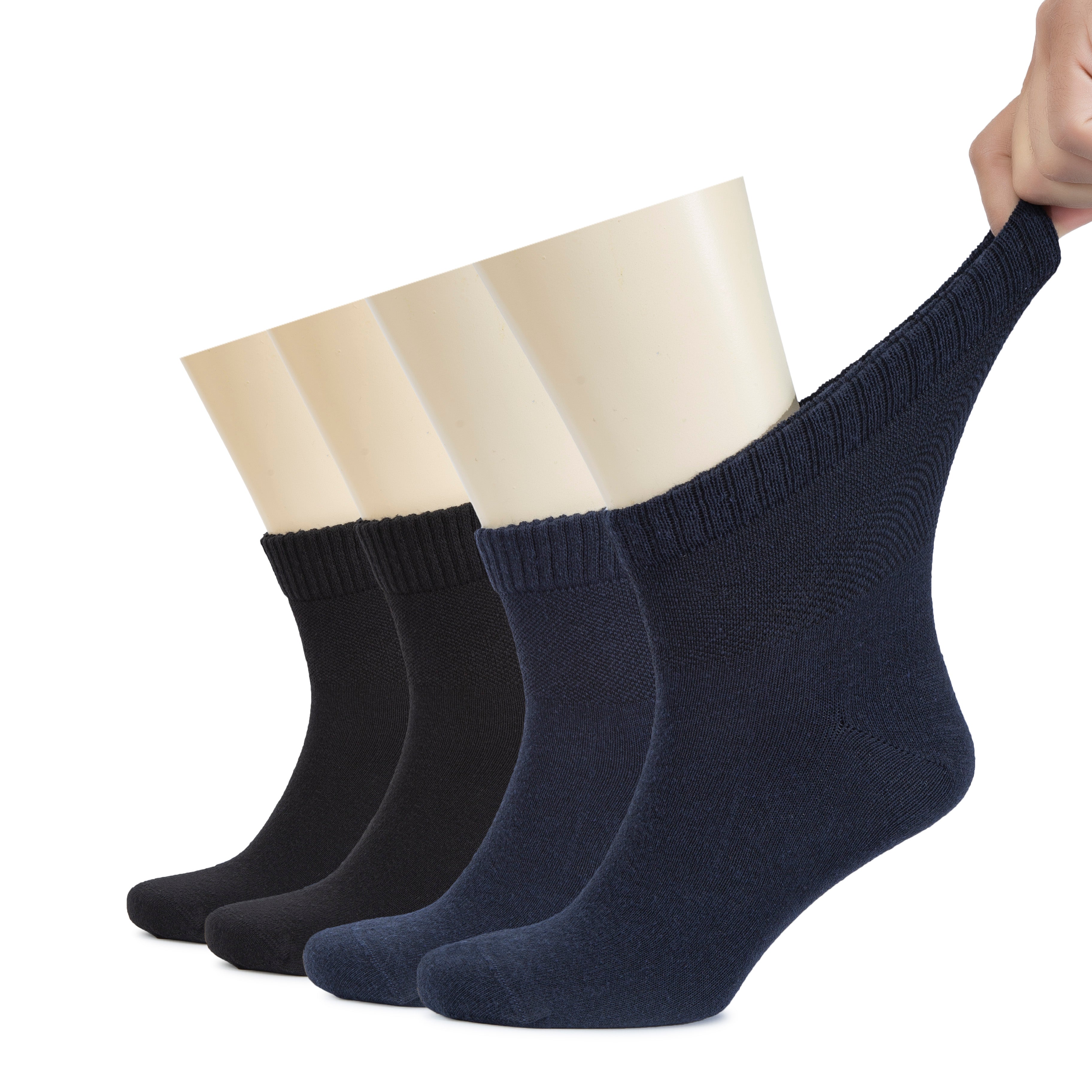 A person holds two pairs of Men's Diabetic Ankle Socks, designed for comfort and support.