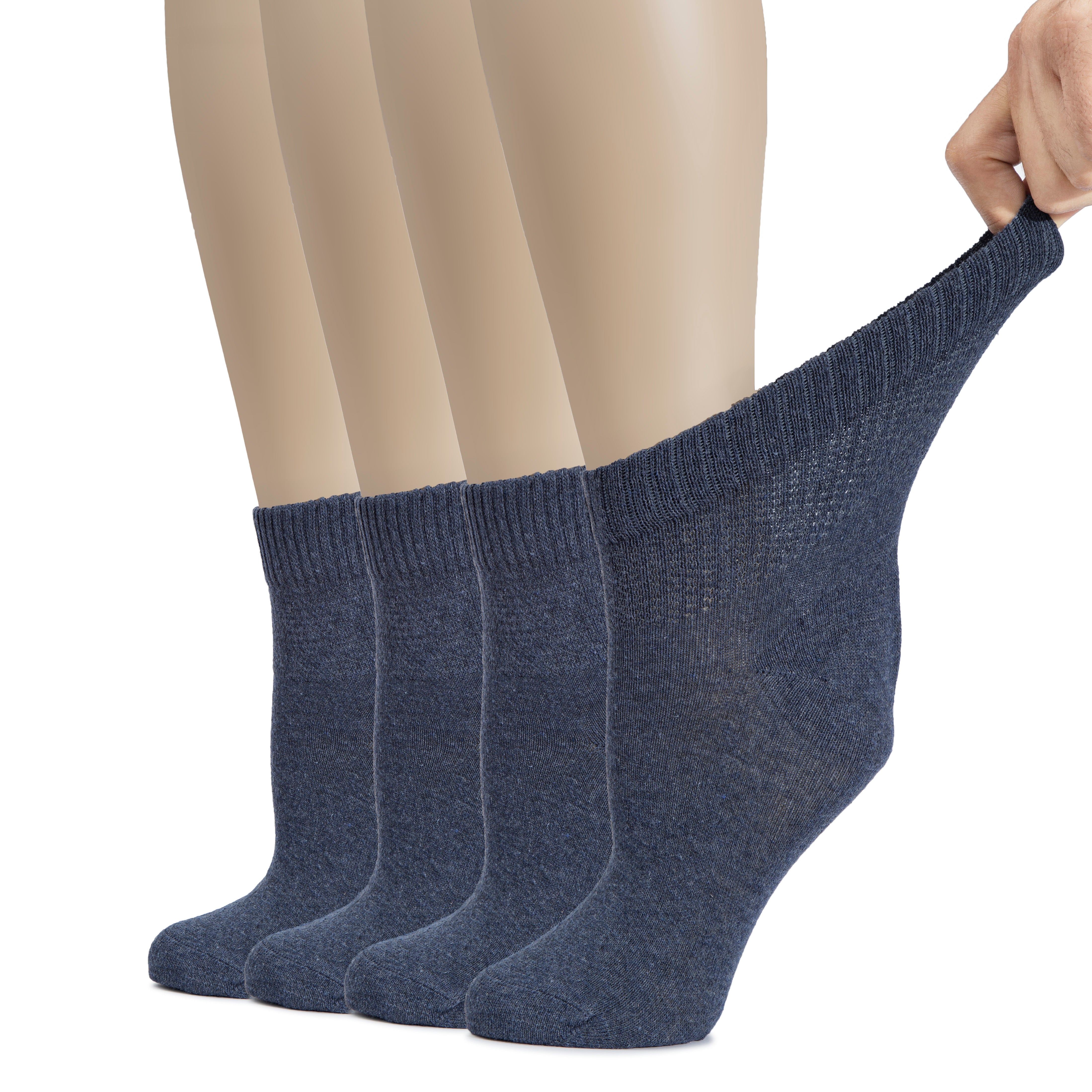  An image of a woman's feet in Charcoal socks, one foot lifted. These Women's Cotton Diabetic Ankle Socks provide a comfortable and supportive fit.