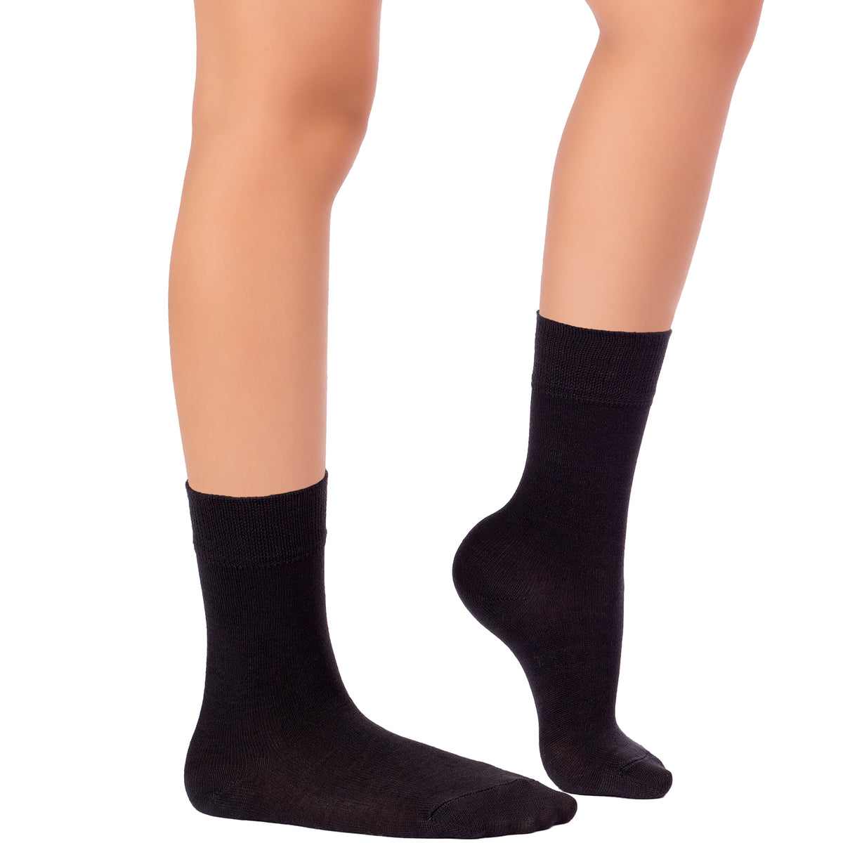 This image depicts a woman's legs adorned in black socks against a white background. The socks are the 'Kids' Dress Crew Bamboo' variety.