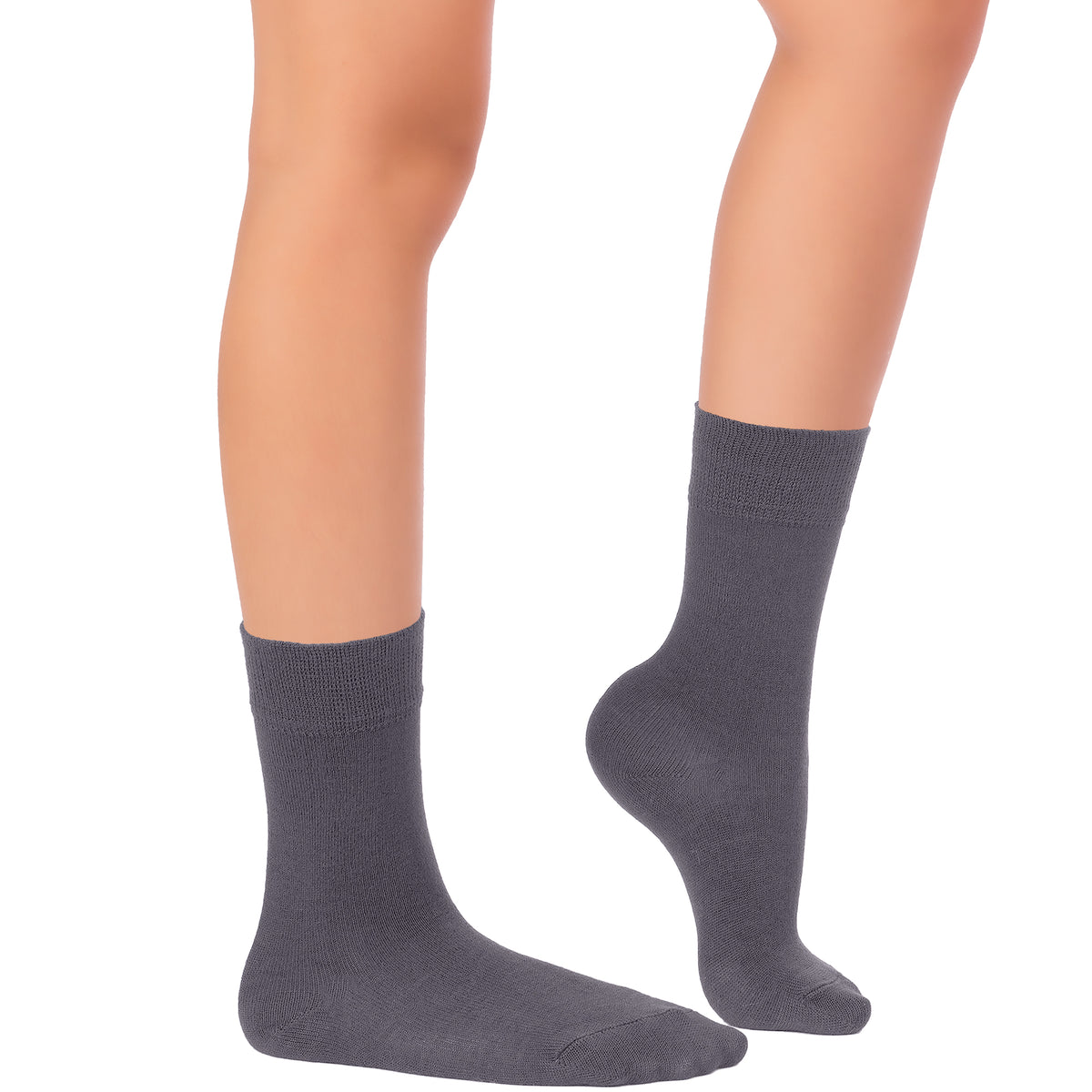 This image depicts a woman's legs adorned in grey socks, wearing Kids' Dress Crew Bamboo.