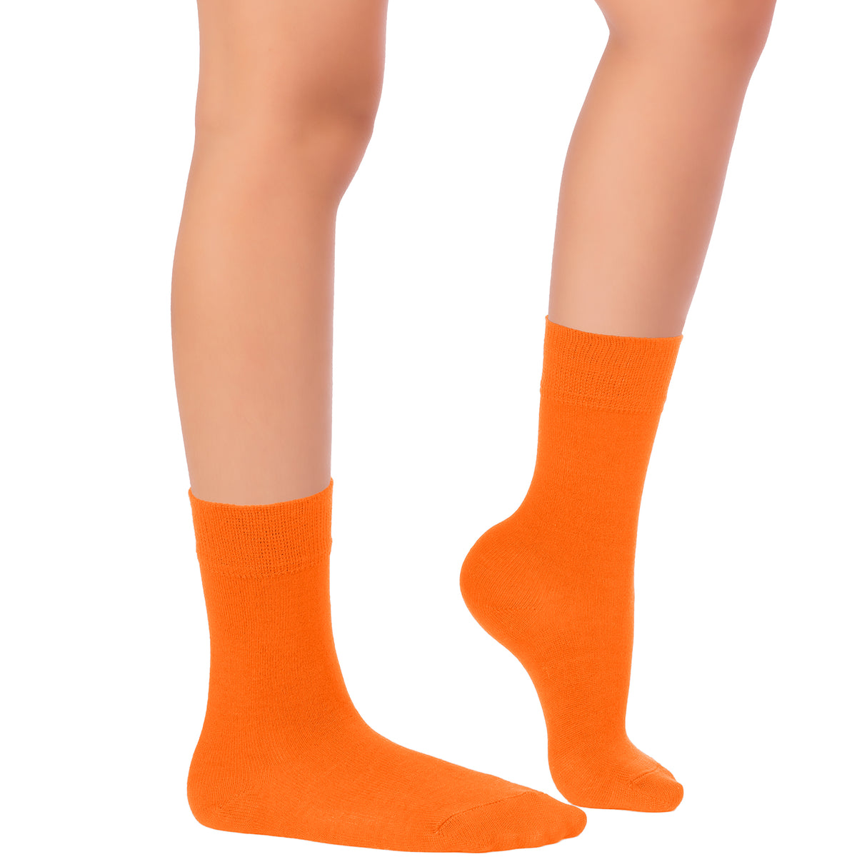 An image of a woman's legs wearing orange Kids' Dress Crew Bamboo socks on a white background.