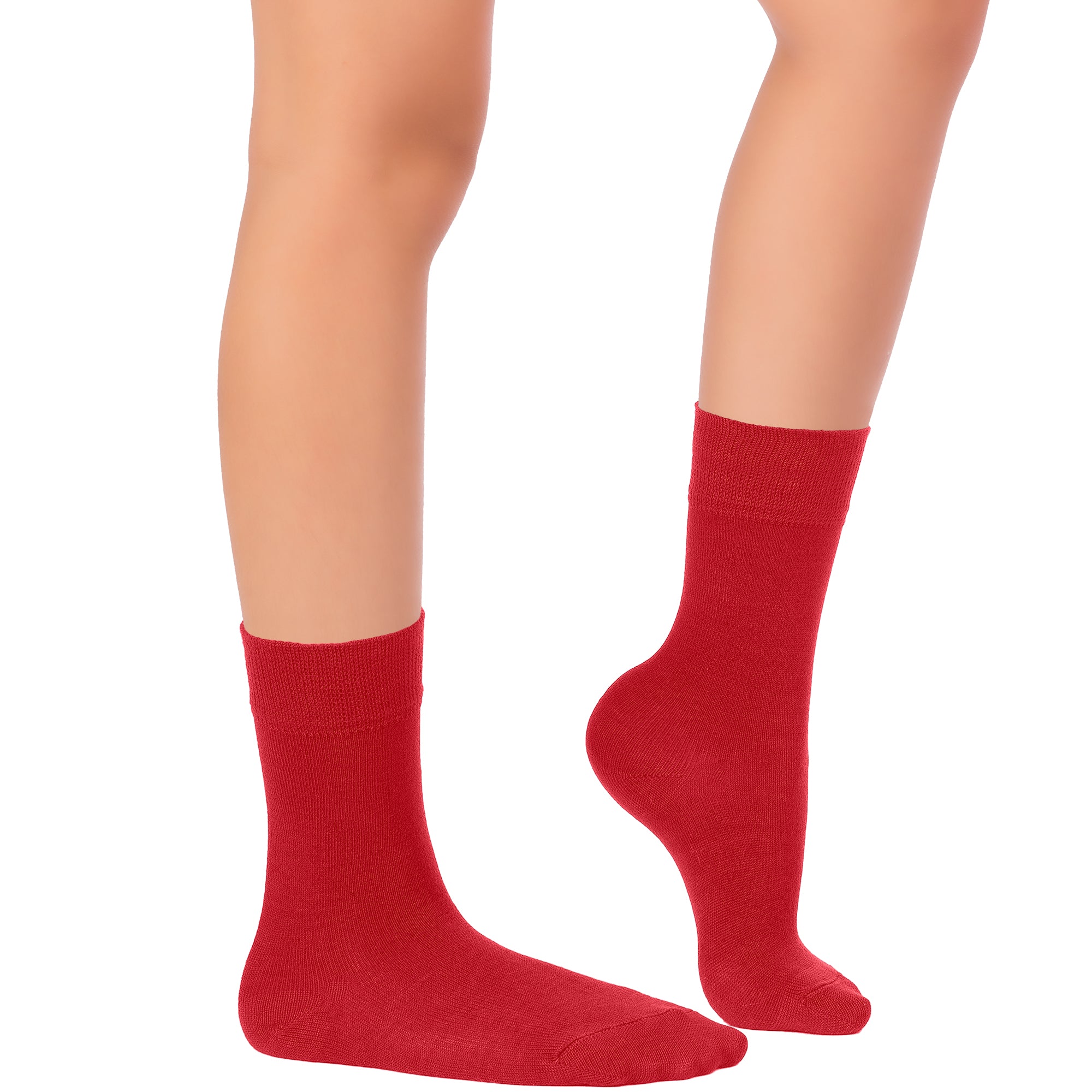 This image depicts a woman's legs adorned in red socks, wearing Kids' Dress Crew Bamboo.