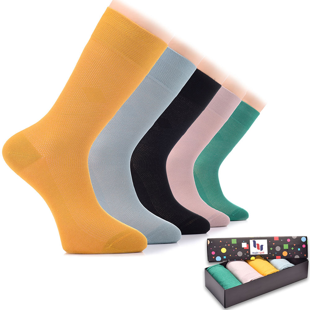 Keep your feet stylish and comfortable with this collection of six pairs of Bamboo Dress Funky Socks, each with its own unique color scheme, all neatly packaged in a box.