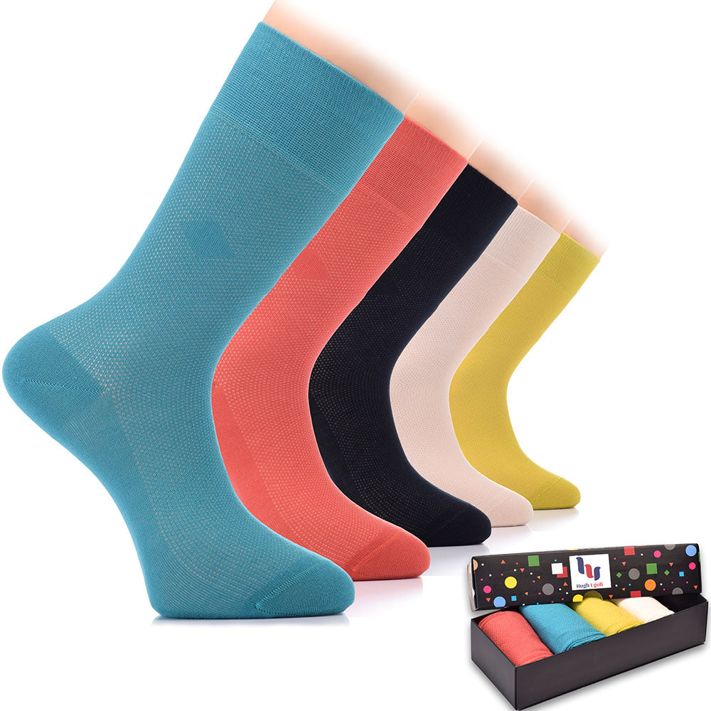 This image showcases a collection of six pairs of Bamboo Dress Funky Socks, each pair boasting a colorful and eye-catching design.