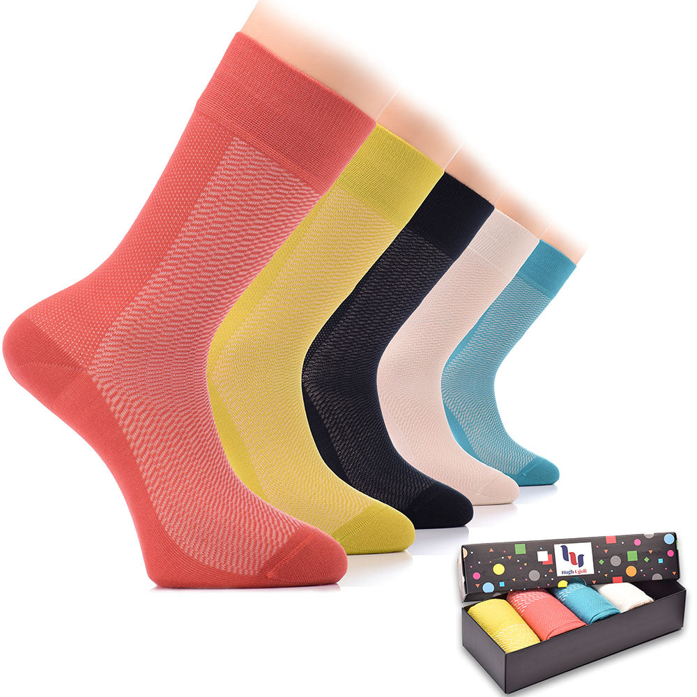 A box containing six pairs of Bamboo Dress Funky Socks, each pair featuring a unique and vibrant color scheme, perfect for adding a pop of color to any outfit.
