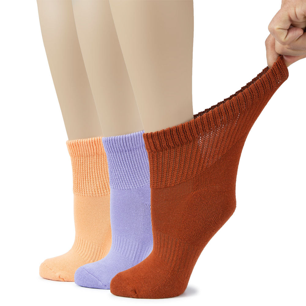 A trio of Women's Cotton Diabetic Ankle Socks in Peach, Aster Blue, and Bombay Brown, each with a unique color scheme.