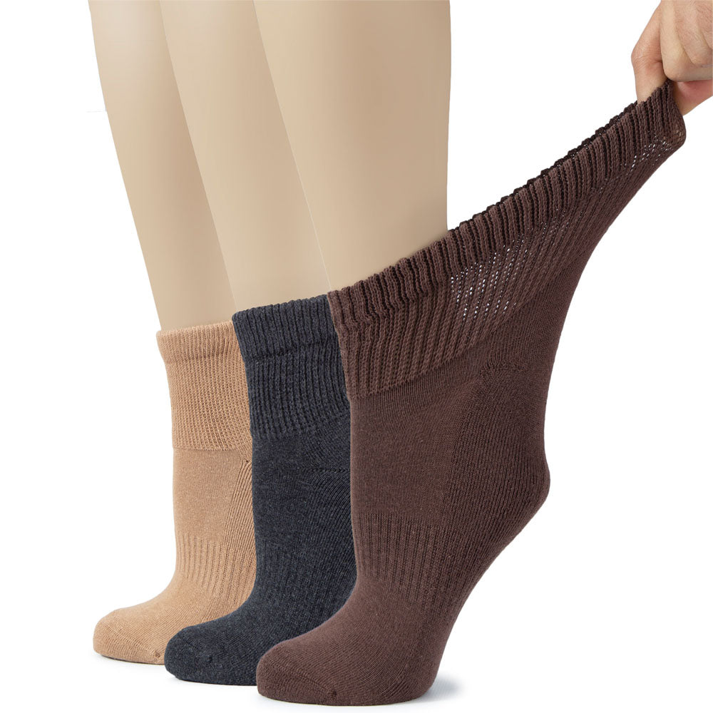 A trio of women's cotton diabetic ankle socks in beige, dark grey, and brown shades are showcased in this image.