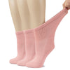 A mannequin displays three pink Women's Cotton Diabetic Ankle Socks, perfect for those with sensitive feet.