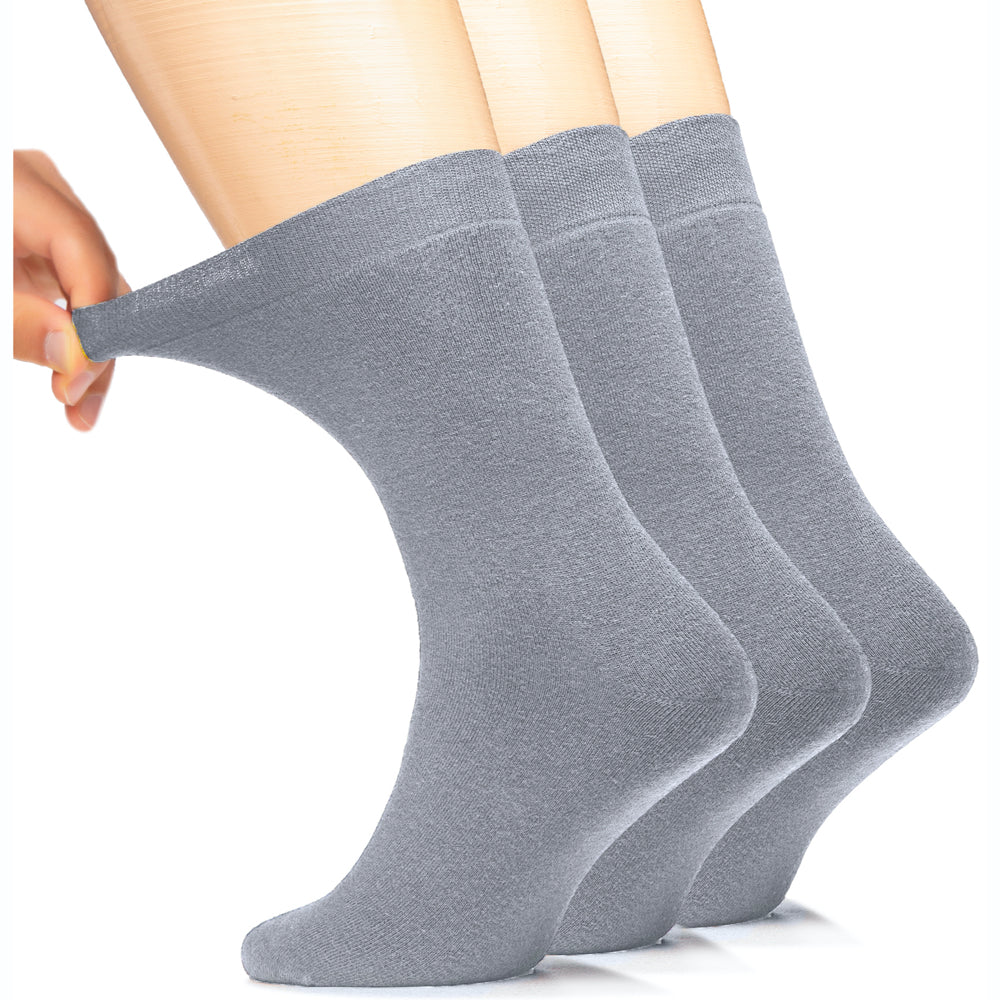 These Men's Cotton Full Cushion Ankle Socks in grey are elegantly displayed on a woman's foot, offering both comfort and durability.
