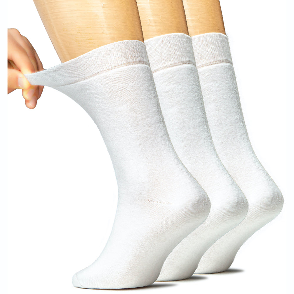 A man's foot is shown wearing three pairs of Men's Cotton Full Cushion Ankle Socks in white.