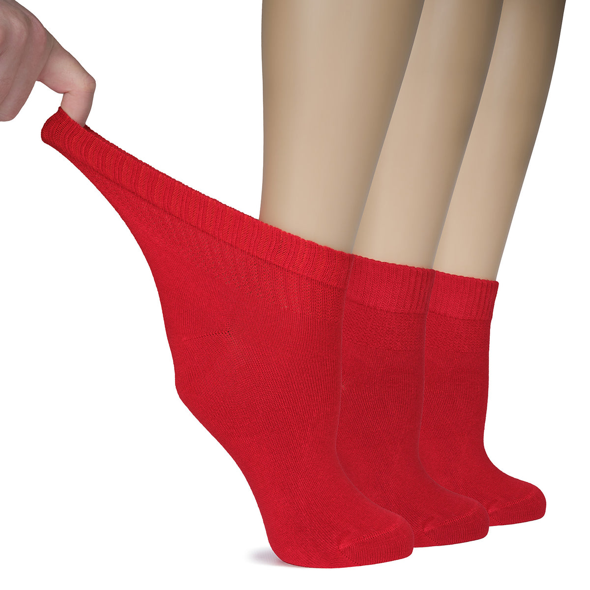 Three red Women's Diabetic Bamboo Ankle Socks are being held by someone, showcasing their softness and durability.