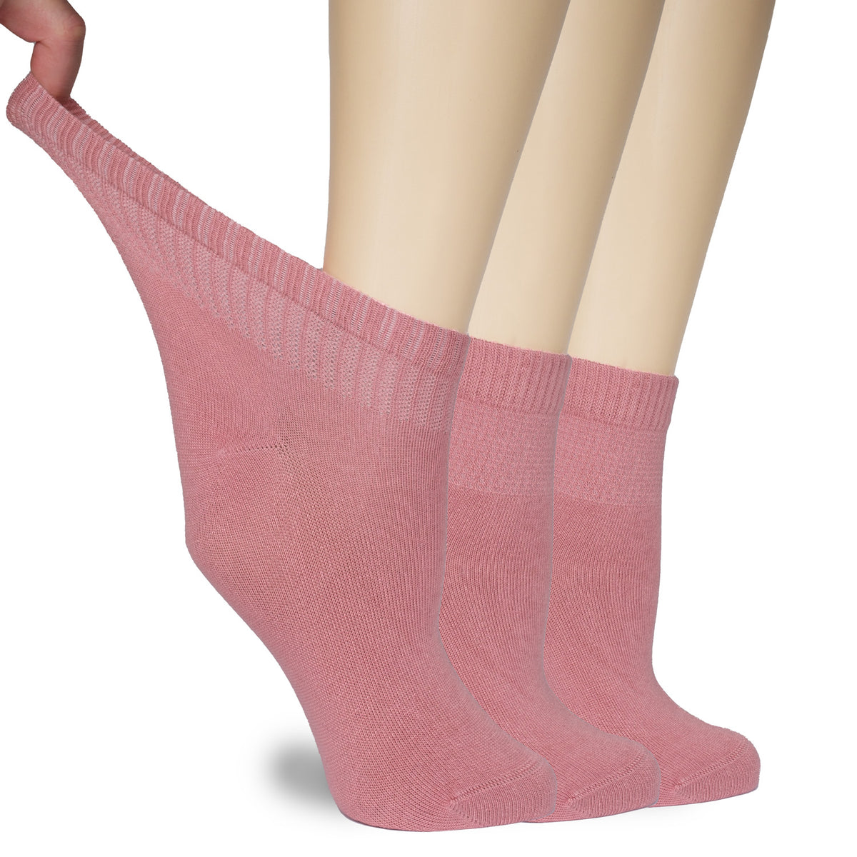 These Women's Diabetic Bamboo Ankle Socks in rose are seen on a woman's legs, offering a comfortable and supportive fit for those with diabetes.