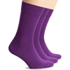 Three women's crew socks made of wool, colored in shades of purple, displayed on a plain white surface.