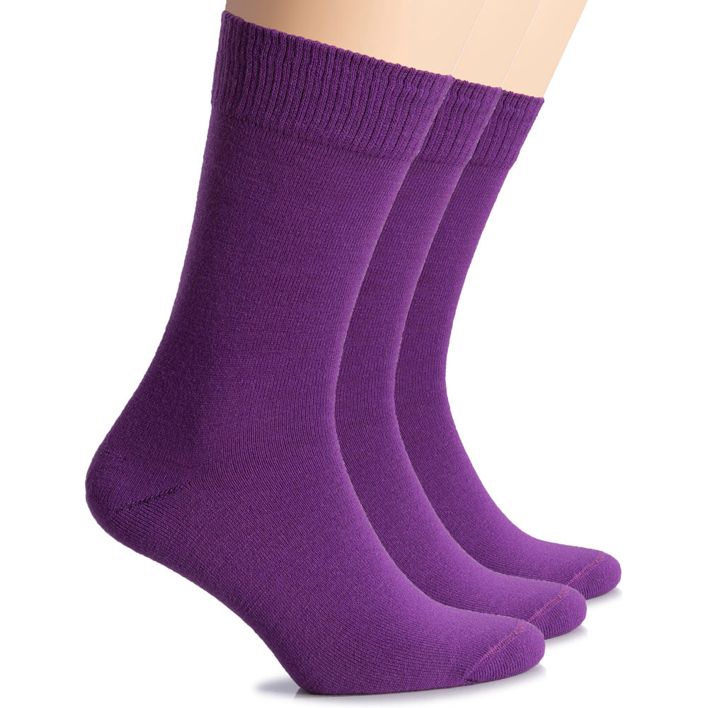 Three women's crew socks made of wool, colored in shades of purple, displayed on a plain white surface.
