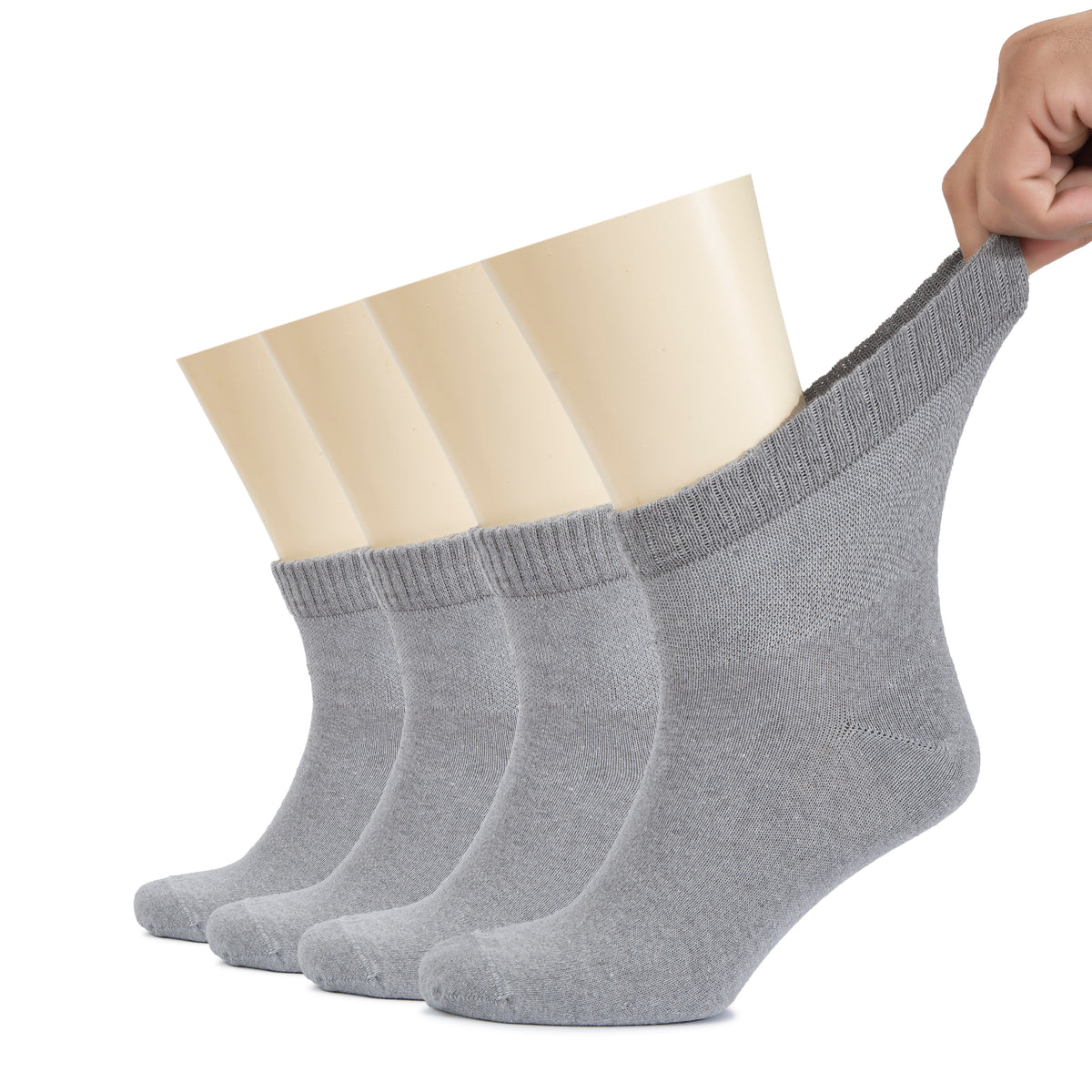 A person is holding a pair of gray Men's Diabetic Ankle Socks, designed to provide comfort and support for those with diabetes or circulation issues.