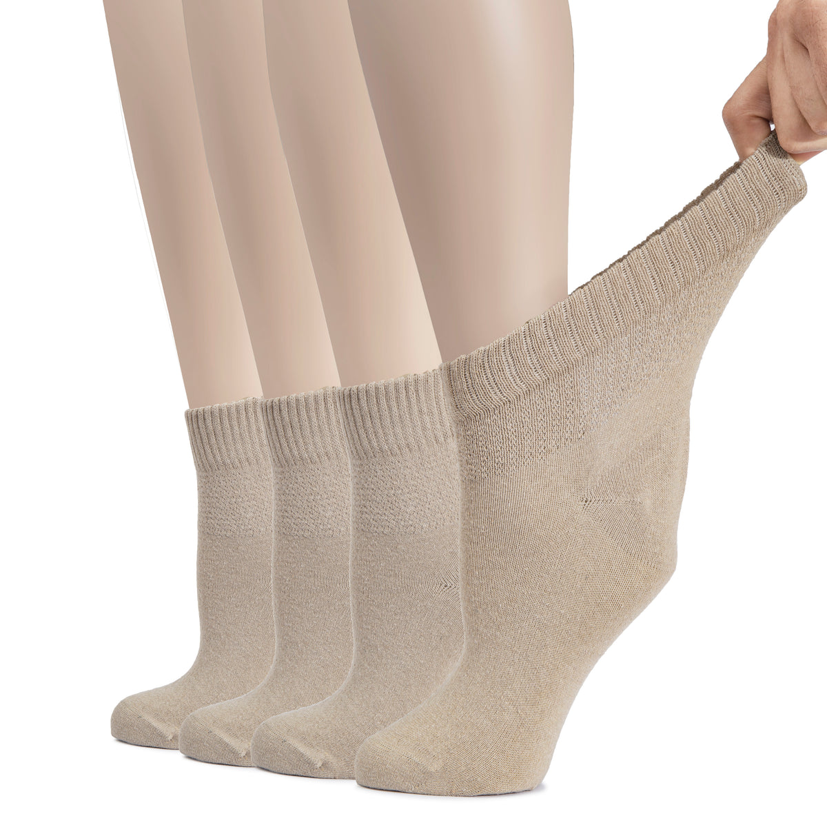 These beige socks are designed for women with diabetes. The image shows a woman's feet in Women's Cotton Diabetic Ankle Socks.