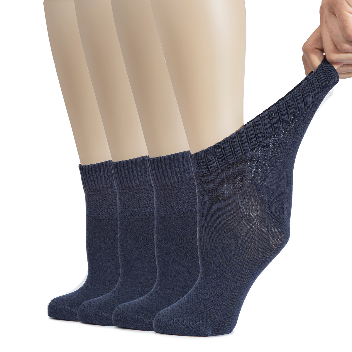 A mannequin displays women's blue cotton diabetic ankle socks, designed for comfort and support.